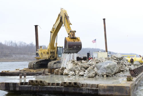 THEBES, Il. - Workers contracted by the Army Corps of Engineers clear rocks from the river floor near Thebes, Il., Dec. 17, 2012. The Coast Guard and USACE are overseeing rock blasting operations due to the low water situation on the Mississippi River. U.S. Coast Guard photo by Petty Officer 3rd Class Ryan Tippets.