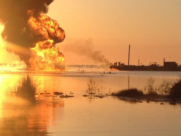 A pipeline burns after an collision with tug boat Shanon E. Setton, near Bayou Perot 30 miles south of New Orleans, March 15, 2013. The Coast Guard is working with federal, state and local agencies in response to this incident to ensure the safety of responders and in insuring the mitigation of any harmful effects to the environment. (Photo courtesy of Terry New)