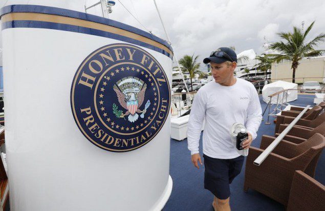 Christopher Hill, a deckhand, walks past a seal on the former presidential yacht, Honey Fitz. REUTERS/Joe Skipper